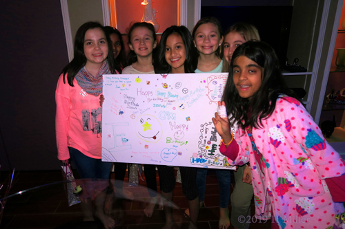 Birthday Girl Holding Her Spa Birthday Card With Friends Birthday Girl Holding Her Spa Birthday Card With Friends