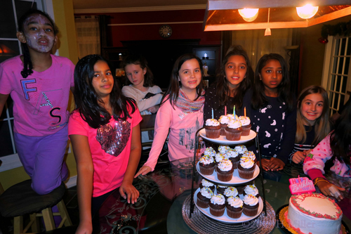 Girls Are Posing With The Cupcakes And Birthday Cake With Big Smiles At The Spa Birthday Party Girls Are Posing With The Cupcakes And Birthday Cake With Big Smiles At The Spa Birthday Party