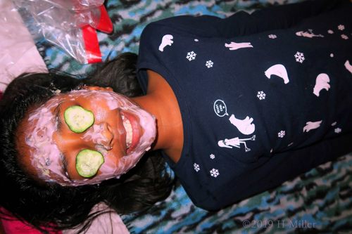She Is Getting A Strawberry Kids Facial With Cukes On Her Eye