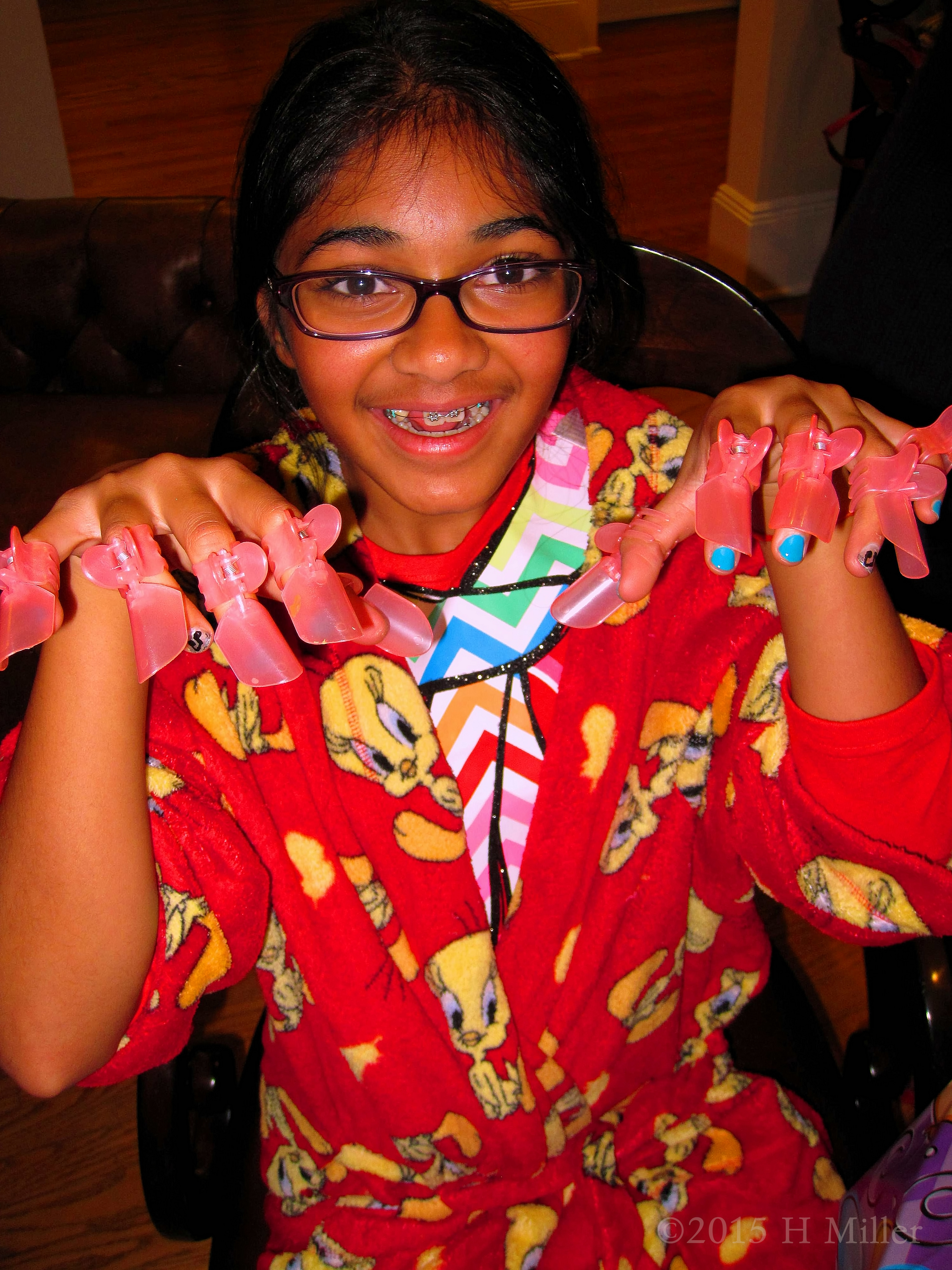 Showing Off Her Nail Protectors After Her Mini Mani Showing Off Her Nail Protectors After Her Mini Mani