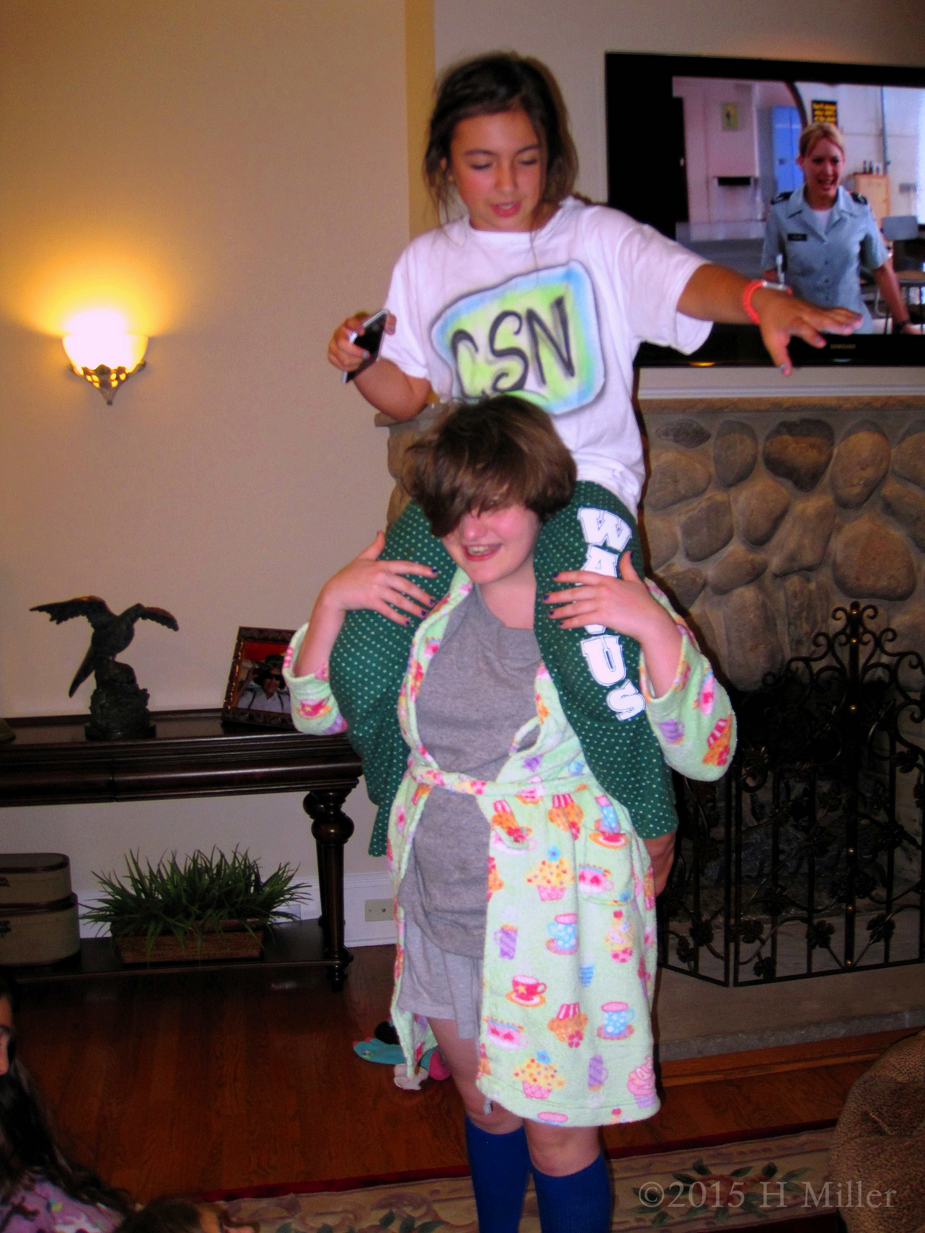 Sitting On Her Friends Shoulders Walking Around The Room At Isha's Birthday Party Sitting On Her Friends Shoulders Walking Around The Room At Isha's Birthday Party