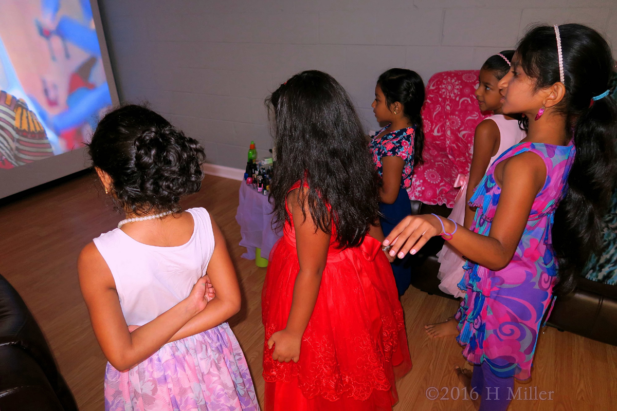 During The Spa Party, The Girls Watch Music Videos And Dance 