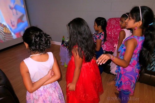During The Spa Party, The Girls Watch Music Videos And Dance During The Spa Party, The Girls Watch Music Videos And Dance