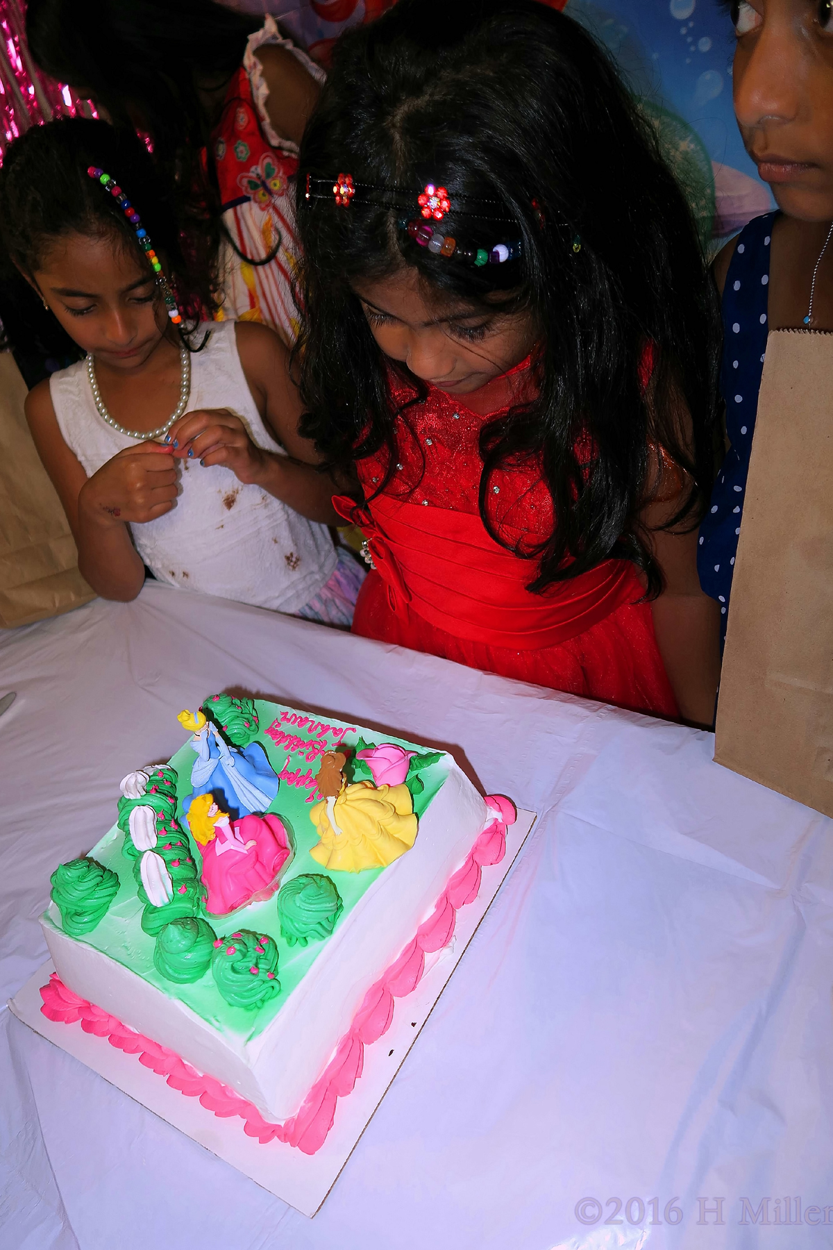 Admiring Her Princess Spa Birthday Cake 