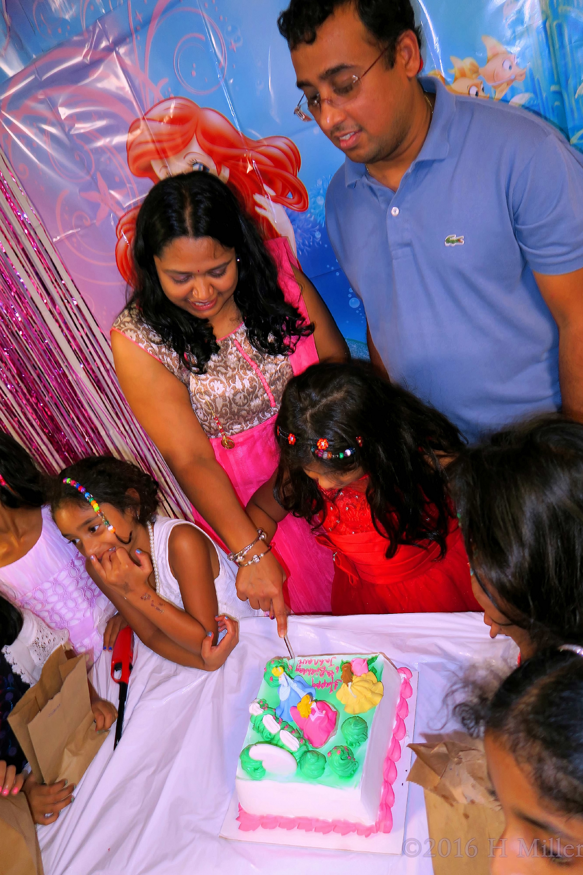 Helping Mom Cut The Cake 