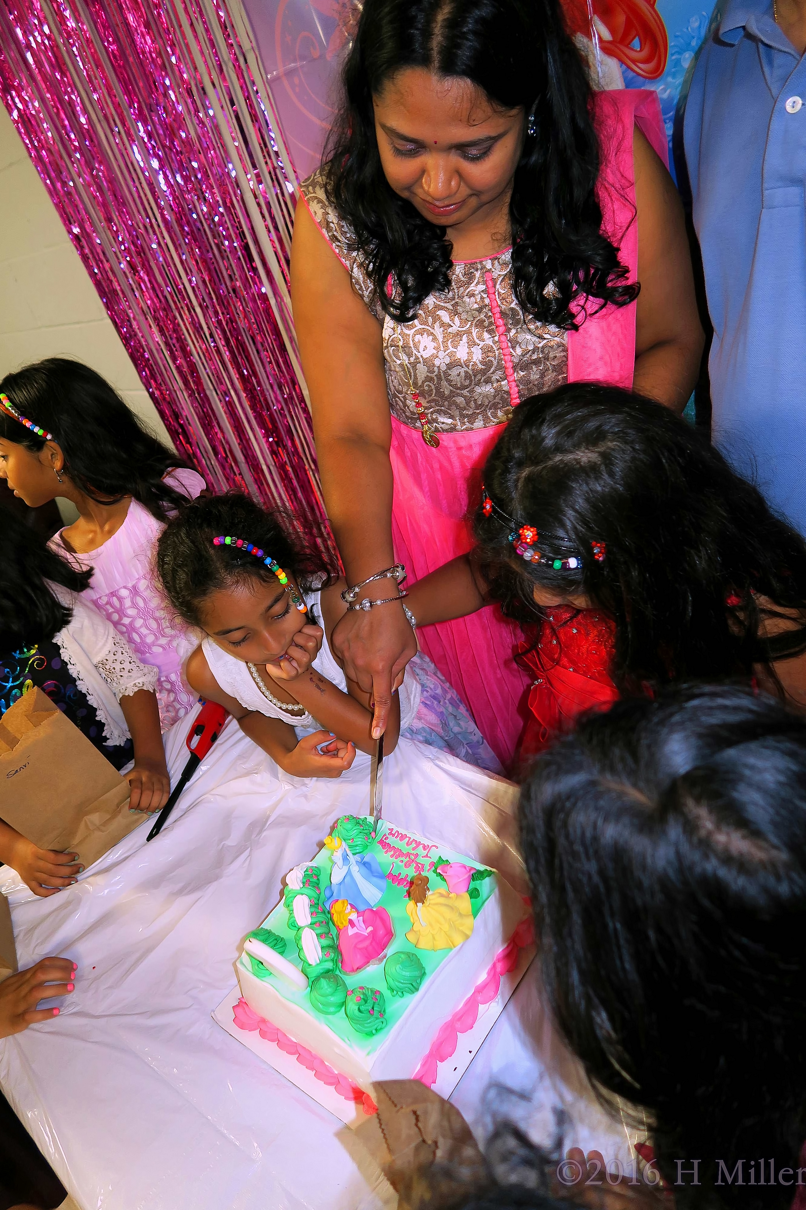 Mom Helps Cut The Cake 