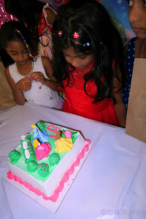 Admiring Her Princess Spa Birthday Cake