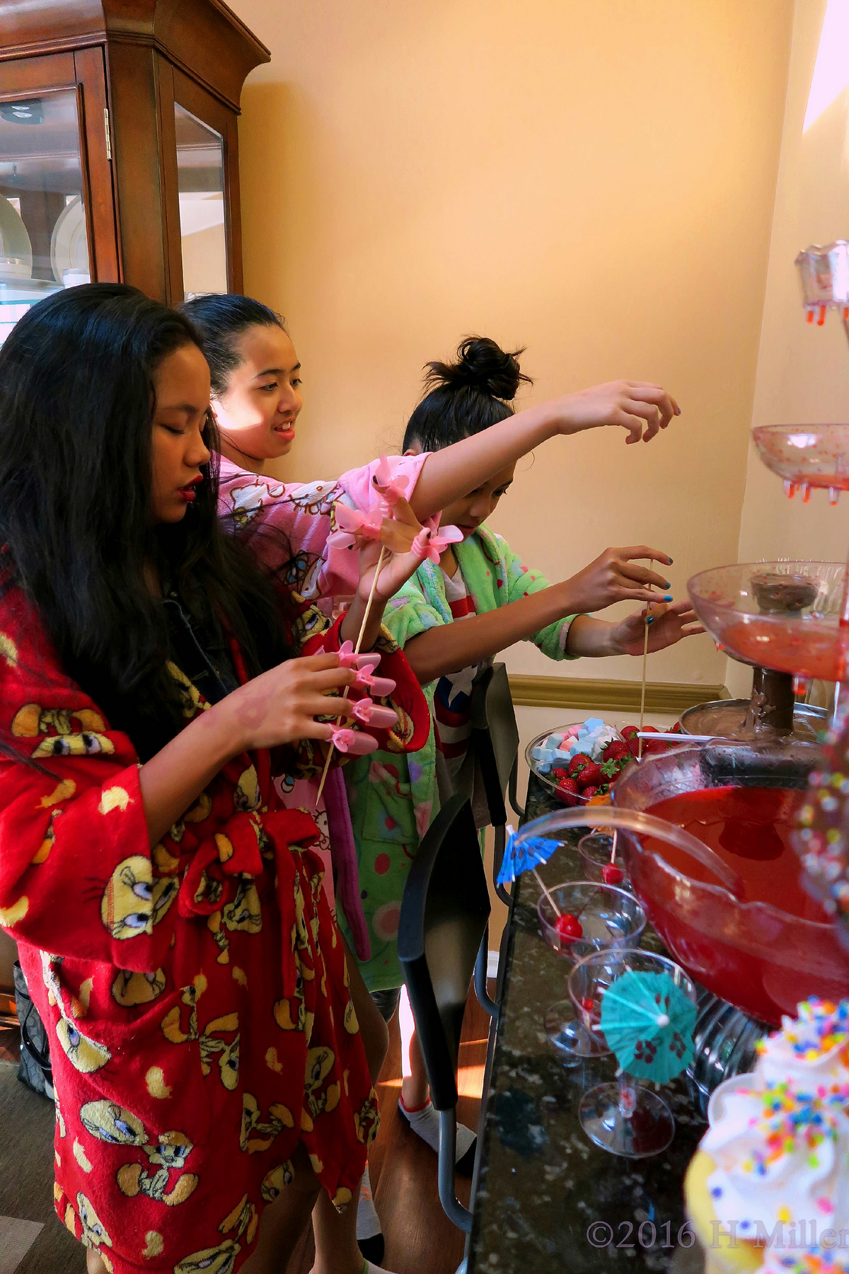 Grabbing Snacks During The Home Kids Spa Party 