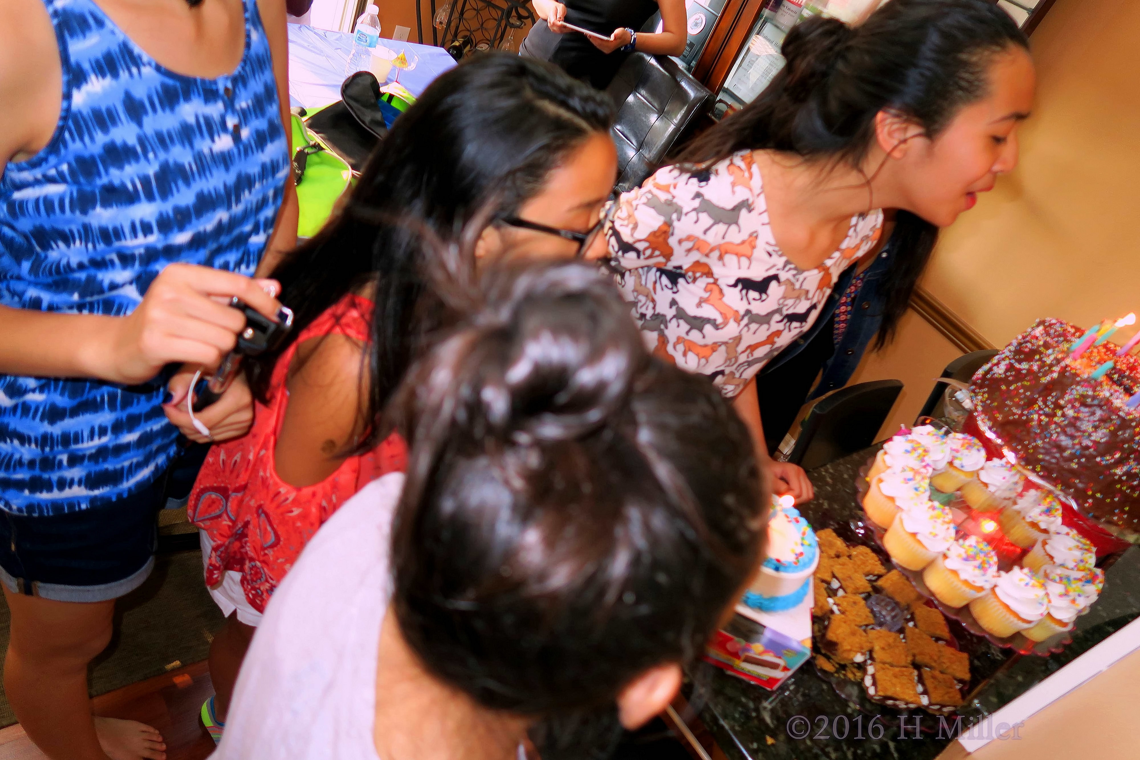 Blowing Out The Candles At The Kids Spa Party 