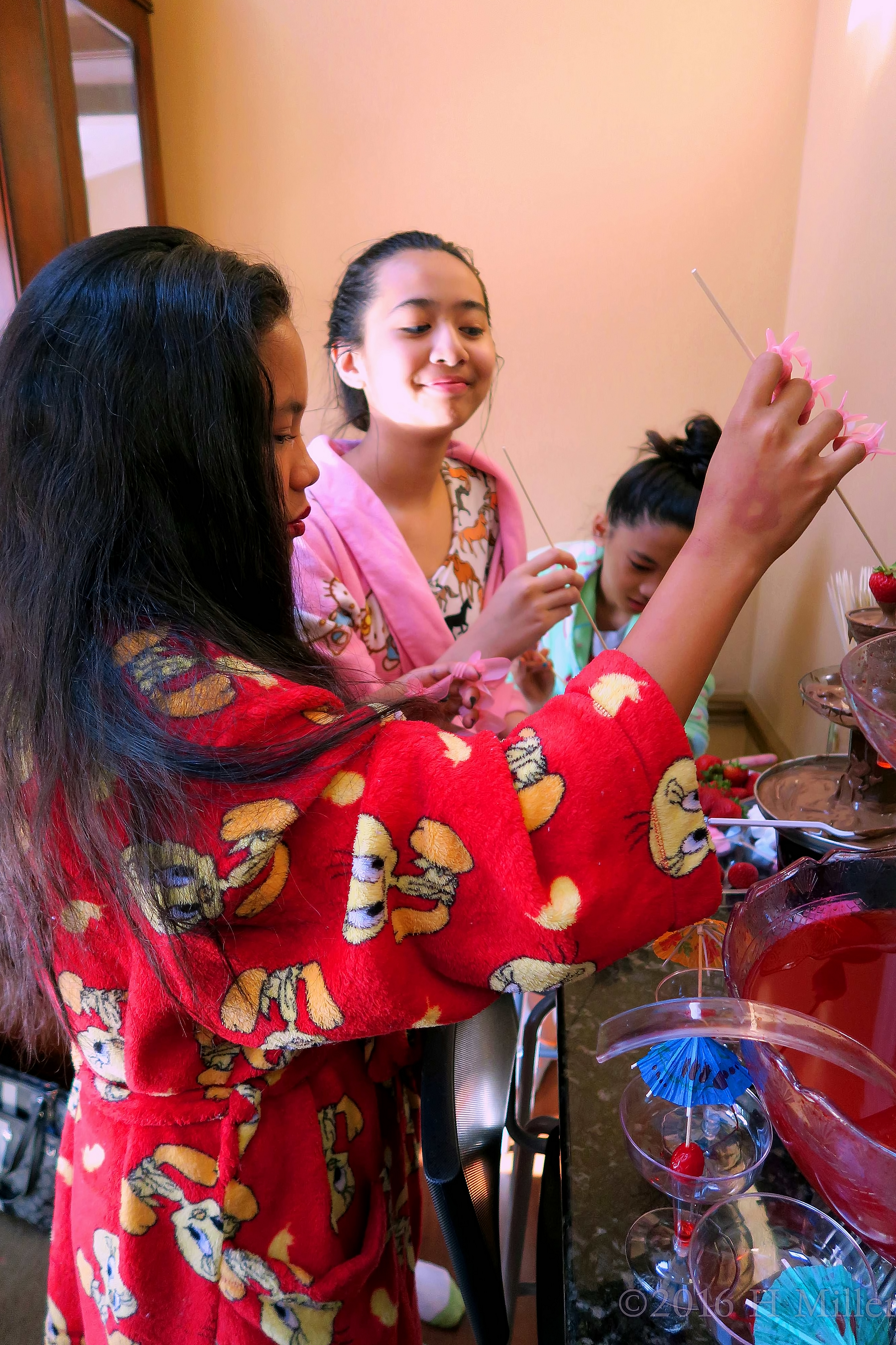 Dipping Strawberries During The Kids Spa Party 