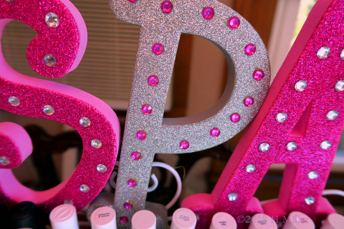 Pink, Glitter Letters Spelling Spa! 