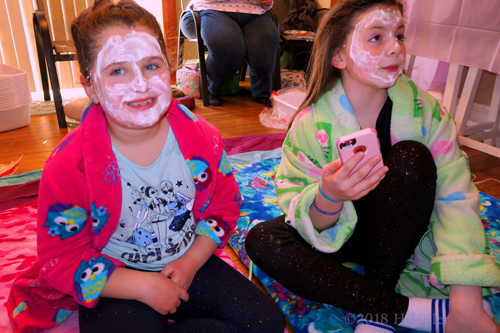 Party Guests Pose With Phone In Face Masks!