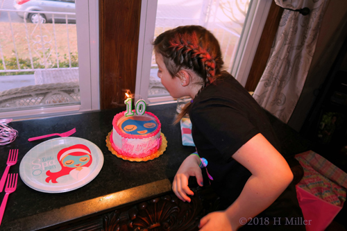 Birthday Girl Blowing Out Her Birthday Candles At The Kids Spa Party!