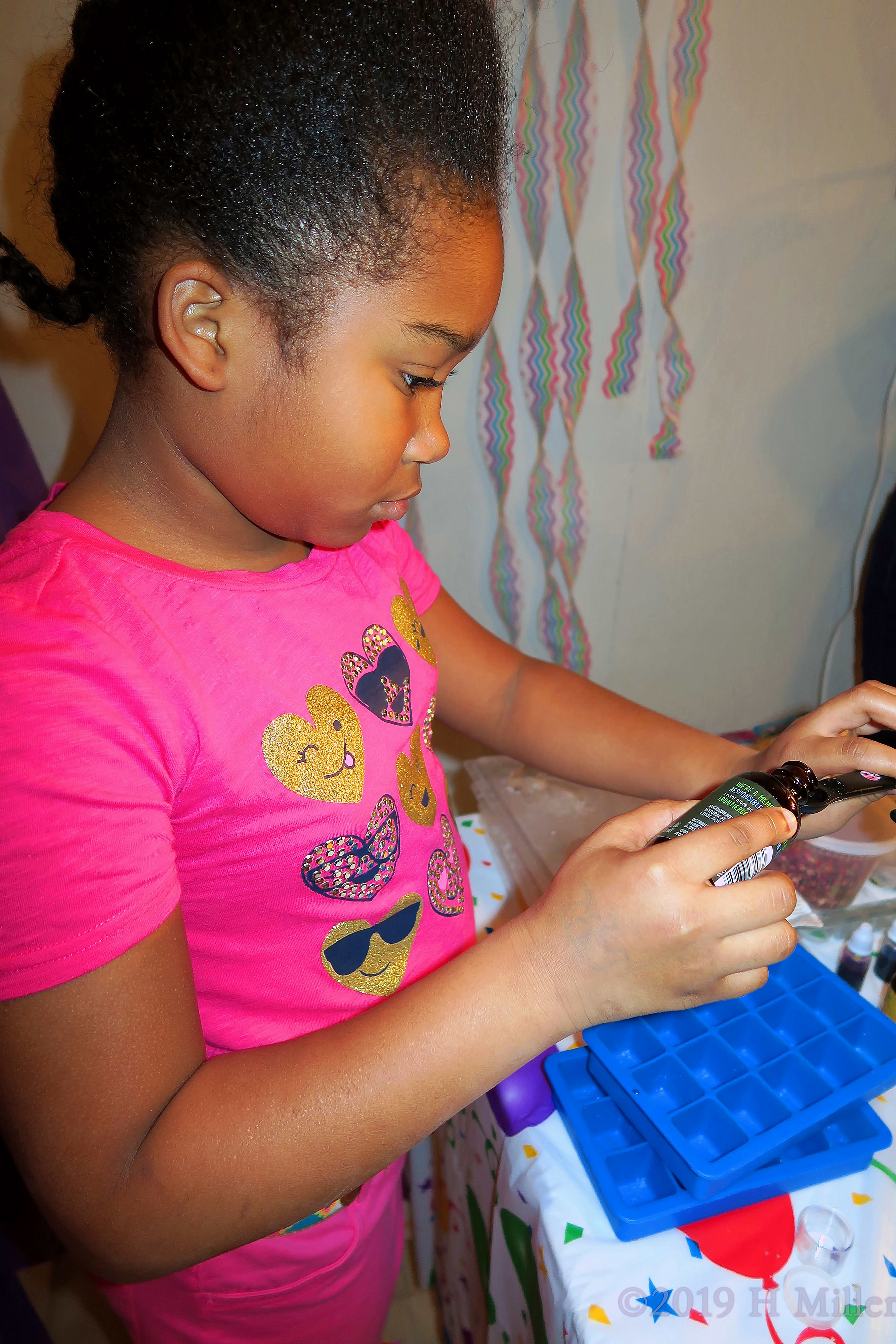 Party Guest Engrossed In Making Her Kids Craft Party Guest Engrossed In Making Her Kids Craft