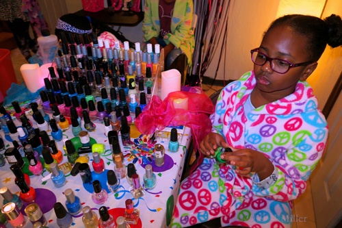 Choosing Her Nail Color At The Girls Manicure Station Choosing Her Nail Color At The Girls Manicure Station