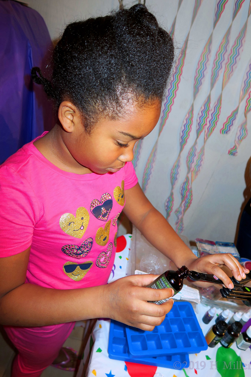 Pouring Her Dye Color For A Pretty Fun Bath Bomb Kids Craft. Pouring Her Dye Color For A Pretty Fun Bath Bomb Kids Craft.