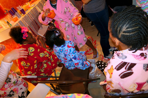 The Birthday Girl Giving Out Party Snacks. The Birthday Girl Giving Out Party Snacks.