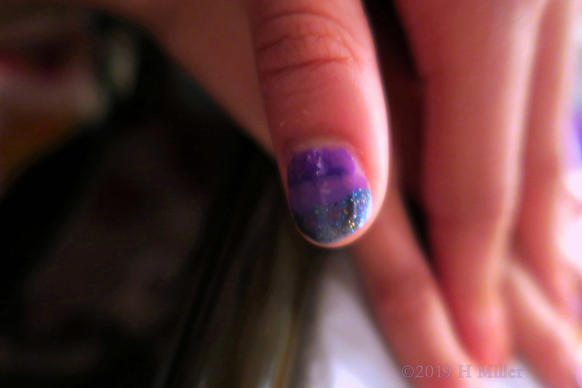 Rainbow Effect Nail Design With Shades Of Purple