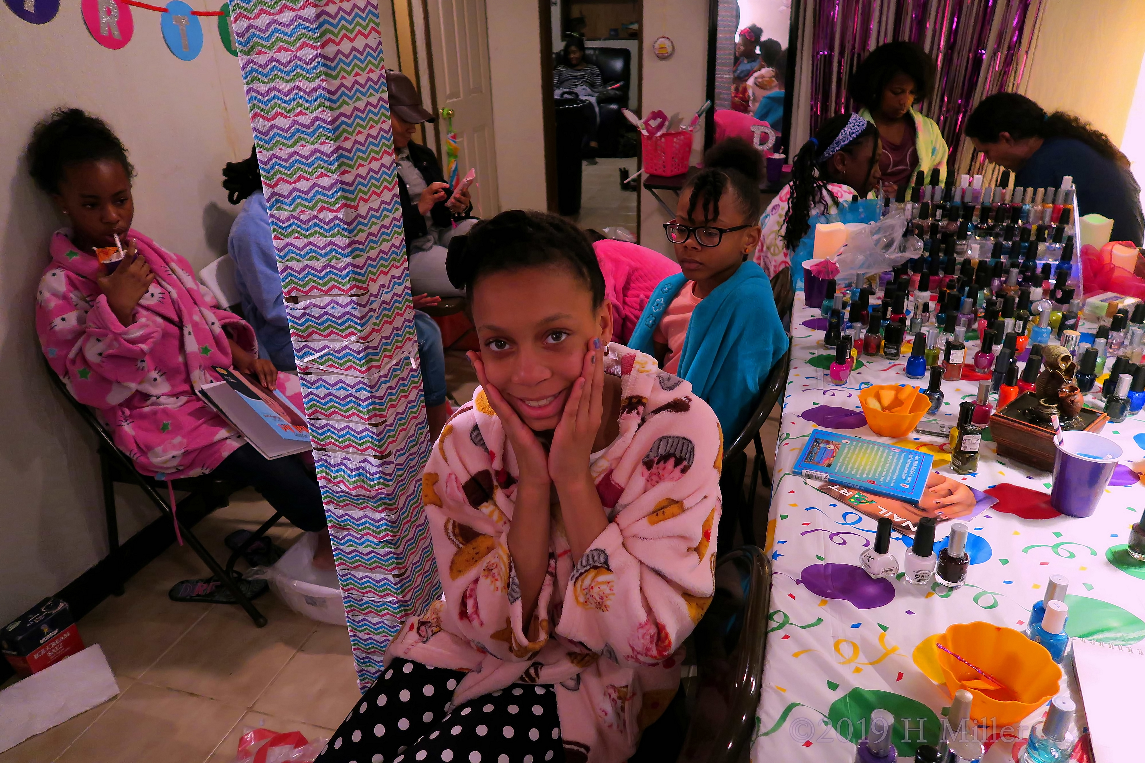 Party Guests Enjoying Themselves At The Nail Art Station. Pretty Girls Manicure For This Party Guest! Party Guests Enjoying Themselves At The Nail Art Station. Pretty Girls Manicure For This Party Guest!