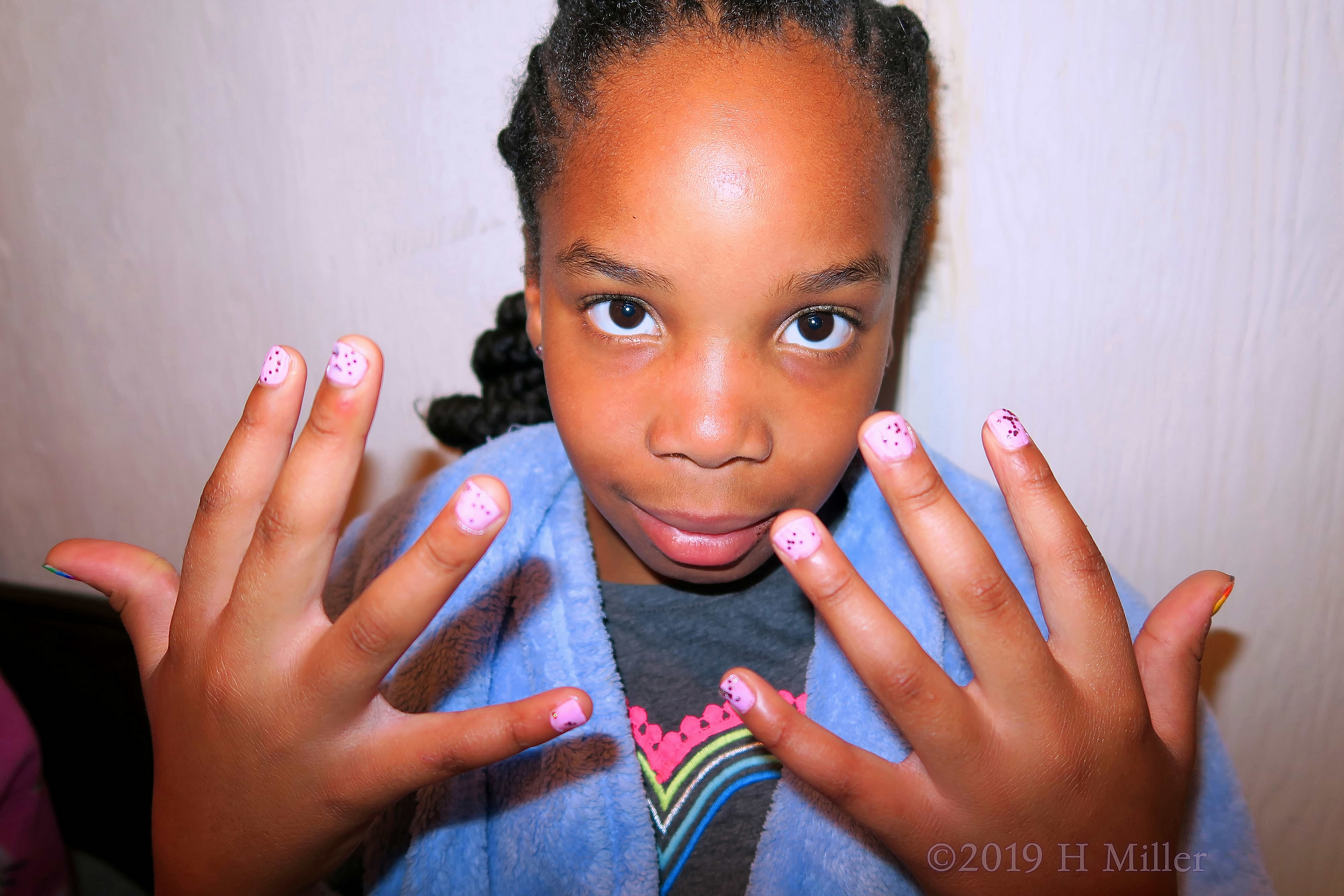 Pleased with Her Pink Polka Dot Girls Manicure Creation. Pleased with Her Pink Polka Dot Girls Manicure Creation.