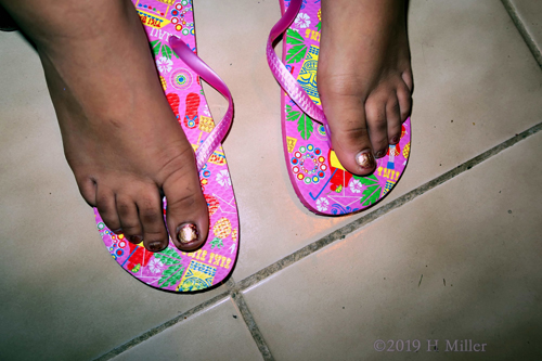 Another Close Up Shot Of Gold Shimmer Kids Pedicure. Another Close Up Shot Of Gold Shimmer Kids Pedicure.
