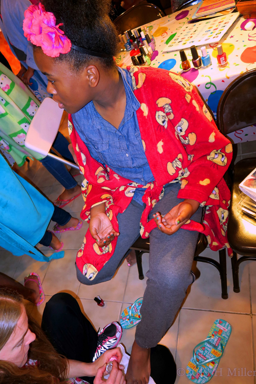 Party Guest Geting Her Kids Pedicure Done By The Host