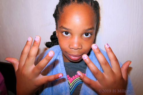 Pleased with Her Pink Polka Dot Girls Manicure Creation. Pleased with Her Pink Polka Dot Girls Manicure Creation.
