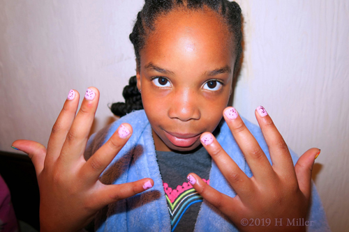 Pleased with Her Pink Polka Dot Girls Manicure Creation.