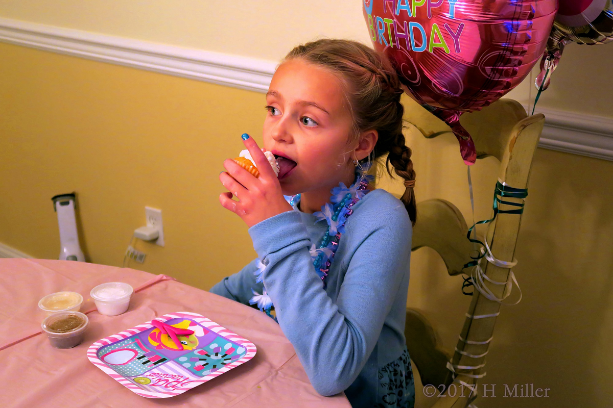 Eating Her Birthday Cupcake 