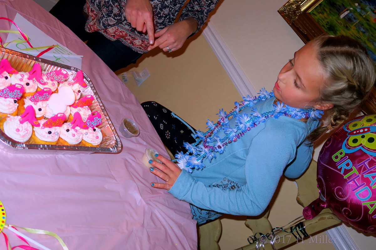 Looking At Her Birthday Cupcakes! 