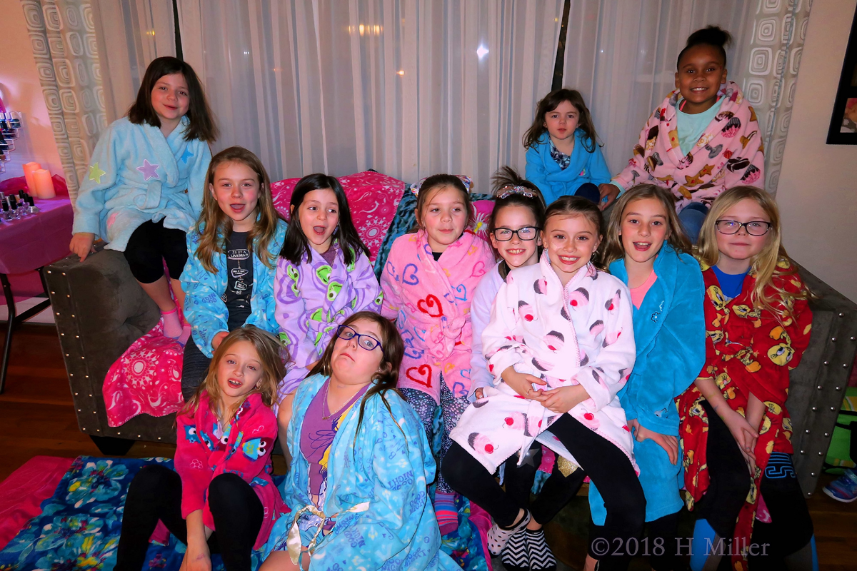 Posing Party Guests In Kids Spa Robes For Group Photo! 