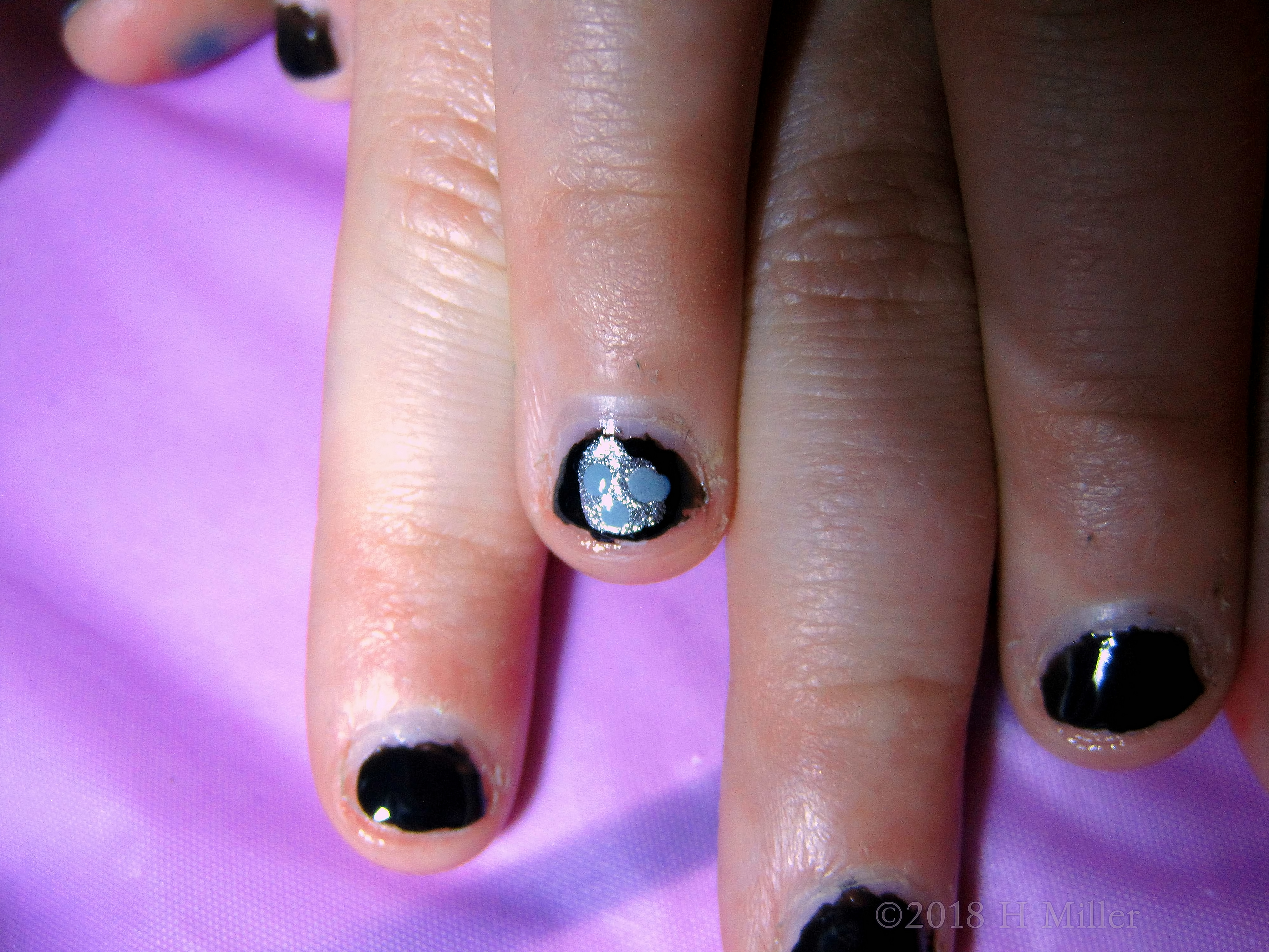 Zoom Up Of Heart Shaped Glitter On Black Shiny Polish For Kids Mani! Zoom Up Of Heart Shaped Glitter On Black Shiny Polish For Kids Mani!