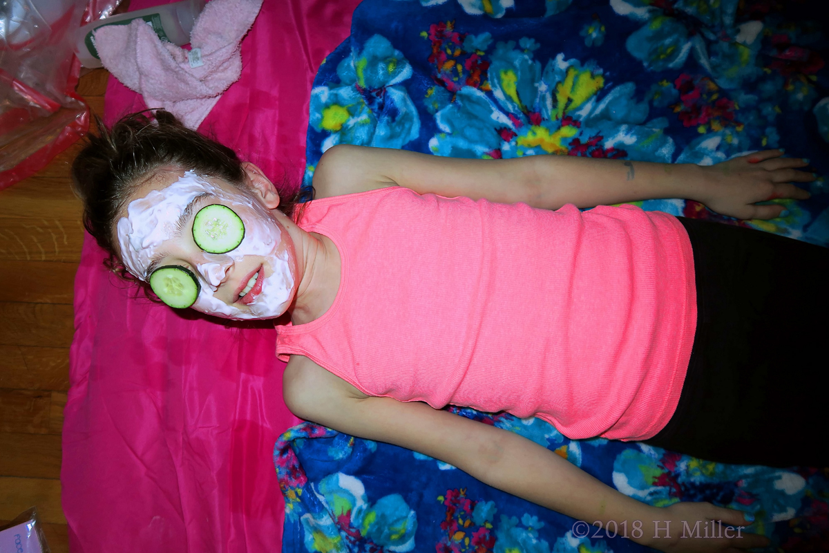 Party Guest Posing Cool As A Cucumber With Her Kids Facial! 