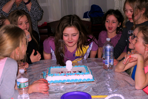 Make A Wish! Birthday Girl Blows Out Birthday Cake Candles!
