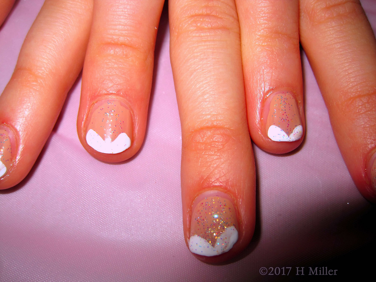 A Close View Of The French Manicure Nail Design For This Kids Manicure With Glitter! 