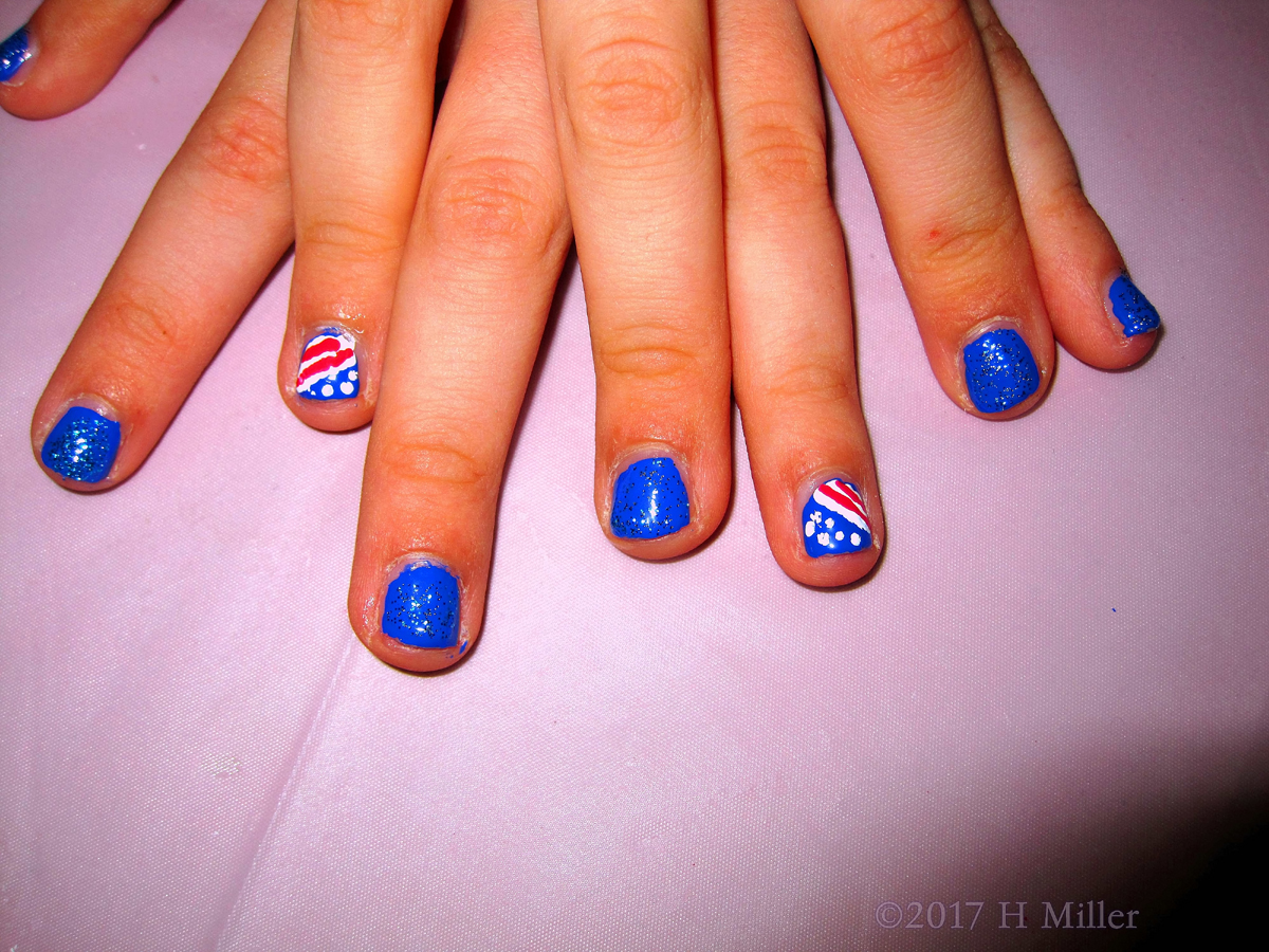 Bright Red White And Blue American Flag Nail Design With Glittery Blue Polish For This Girls Manicure!