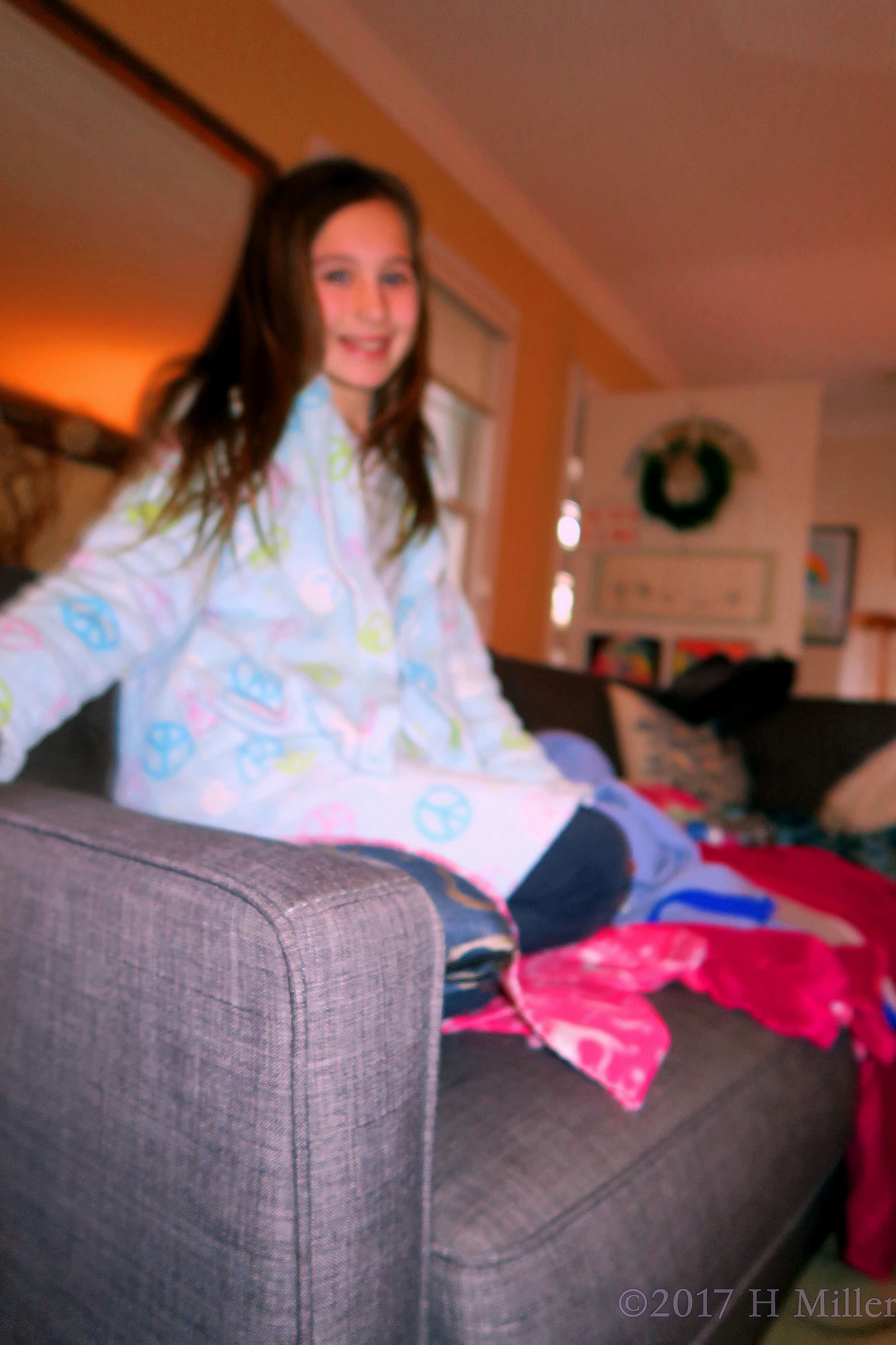 Party Guest Smiling While Sitting On The Sofa 4 Party Guest Smiling While Sitting On The Sofa 4