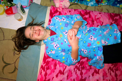 Guest Lying On The Kids Facial Mat Wearing Blue Kitty Spa Robe Guest Lying On The Kids Facial Mat Wearing Blue Kitty Spa Robe