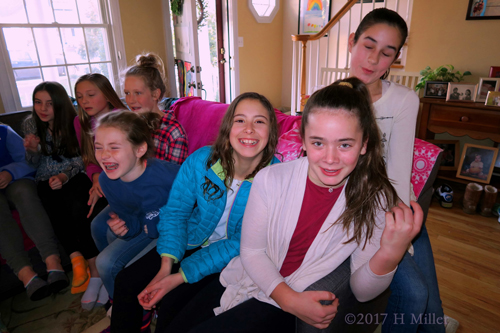 Party Guests Are Having A Fun Time While Taking Group Photos