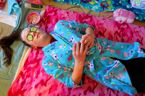 She Is Having A Kids Facial With Cucumbers On Her Eyes She Is Having A Kids Facial With Cucumbers On Her Eyes