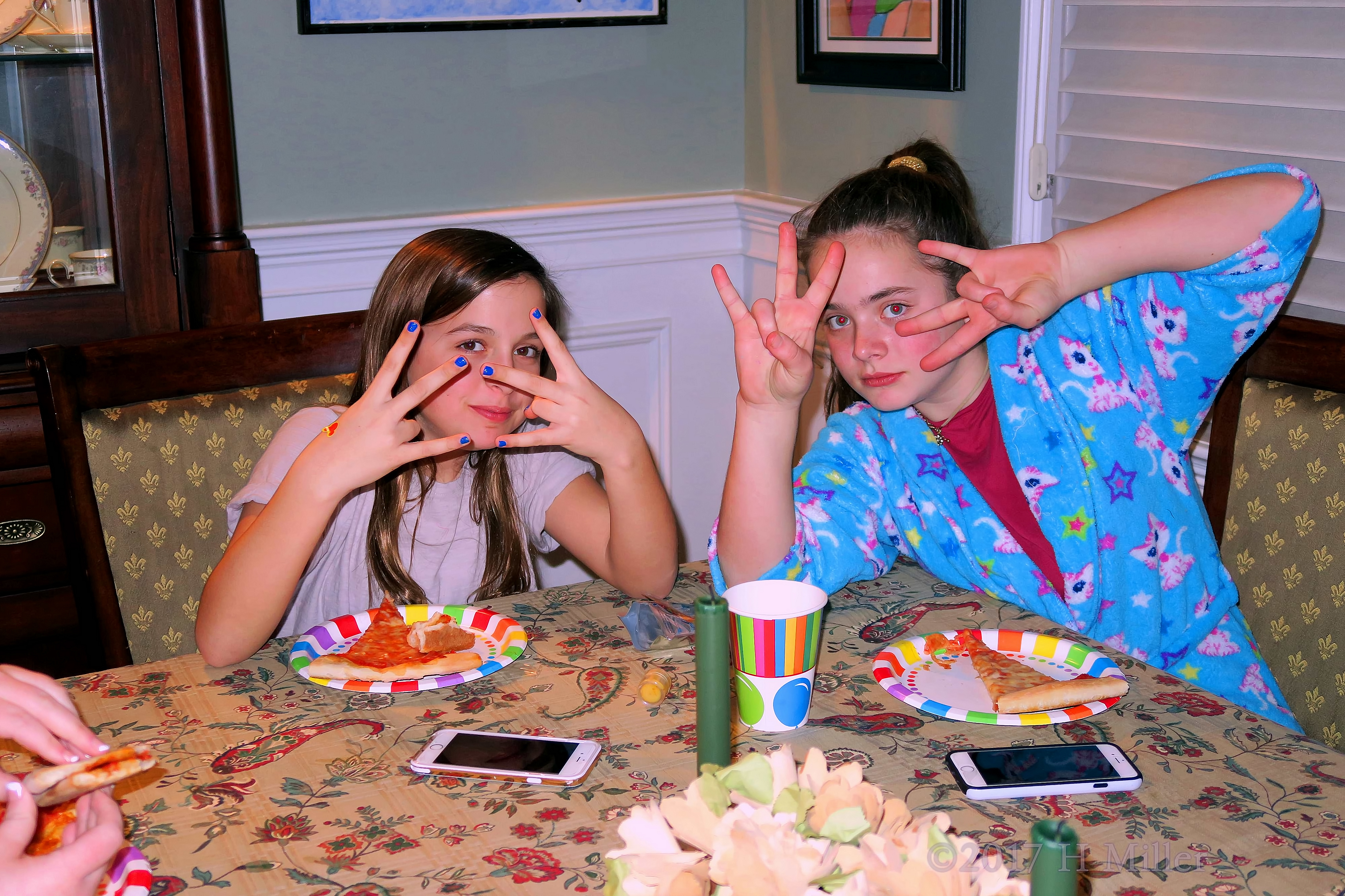 Guests Are Posing While Having Pizza 