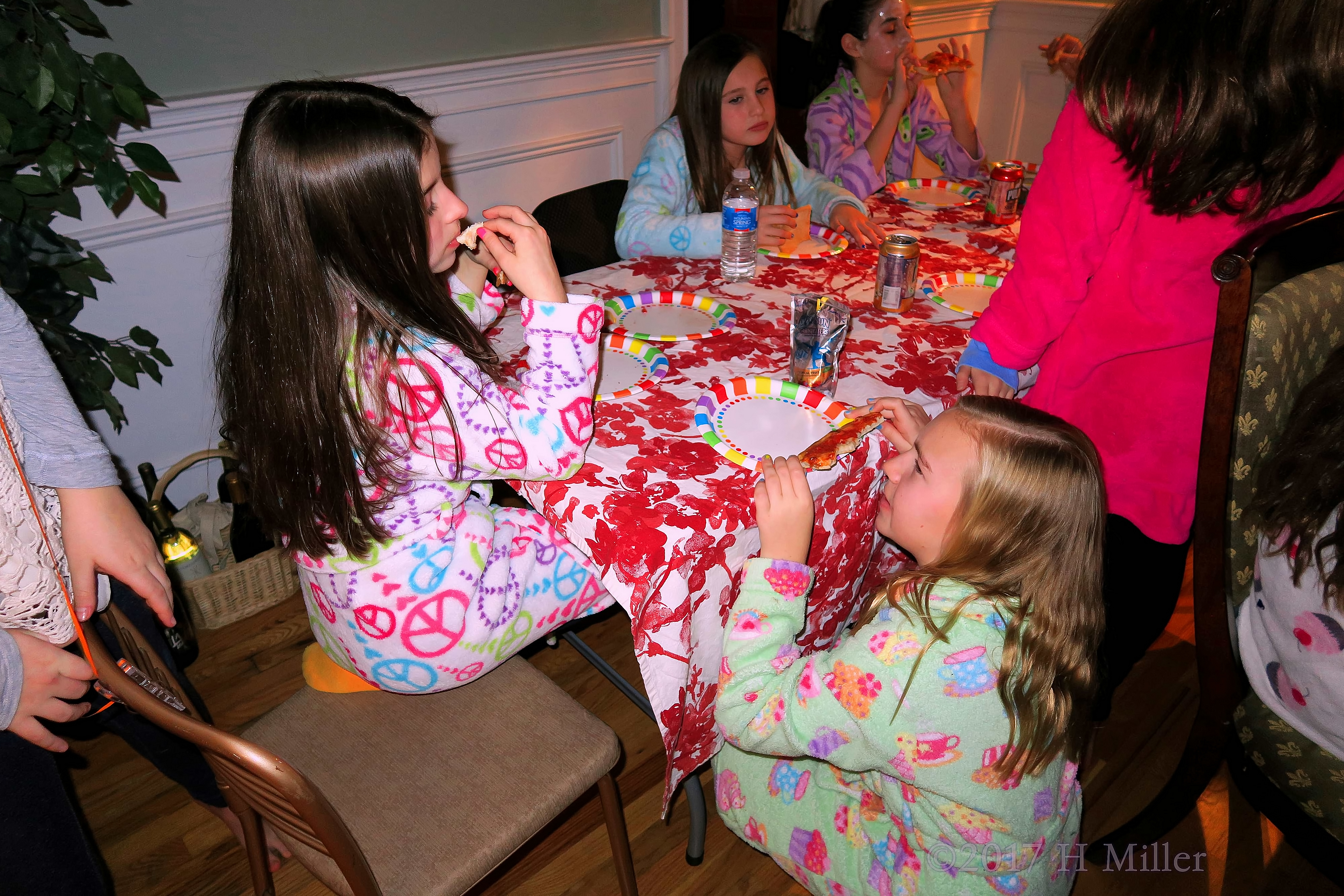 Kate Is Talking With Her Friends At The Snack Table. 