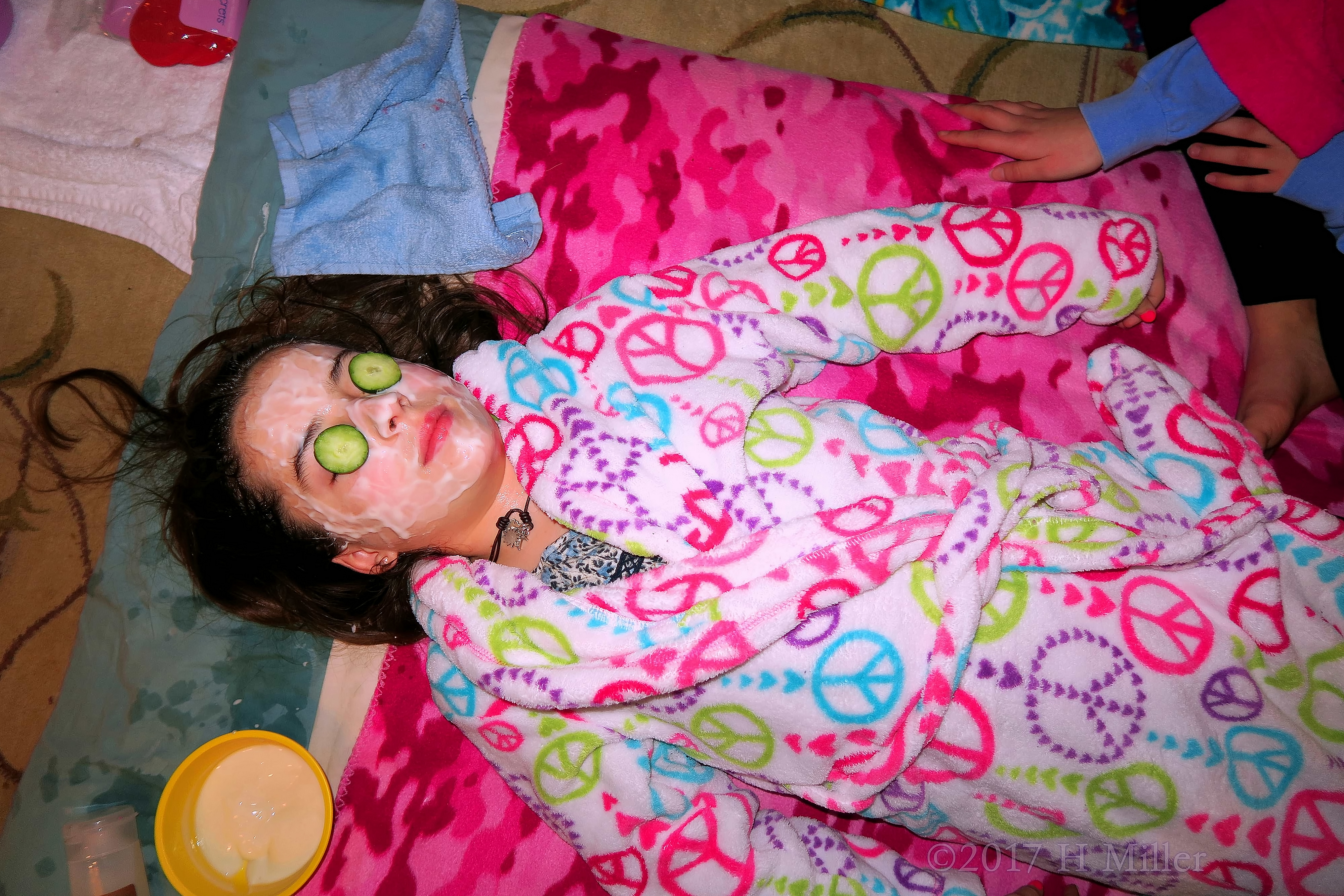 The Birthday Girl Is Having A Kids Facial With Cucumber On Her Eyes And A Strawberry Face Masque The Birthday Girl Is Having A Kids Facial With Cucumber On Her Eyes And A Strawberry Face Masque