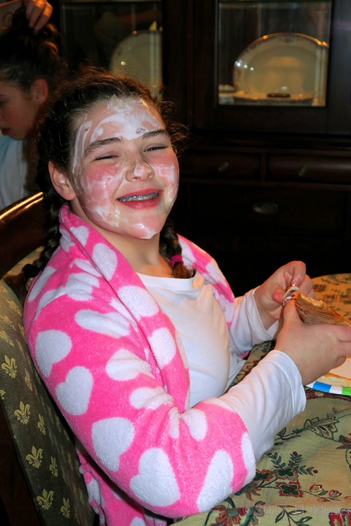 Happy Party Guest Is Smiling With Her Face Masque On Having Pizza At The Spa Birthday Party! Happy Party Guest Is Smiling With Her Face Masque On Having Pizza At The Spa Birthday Party!