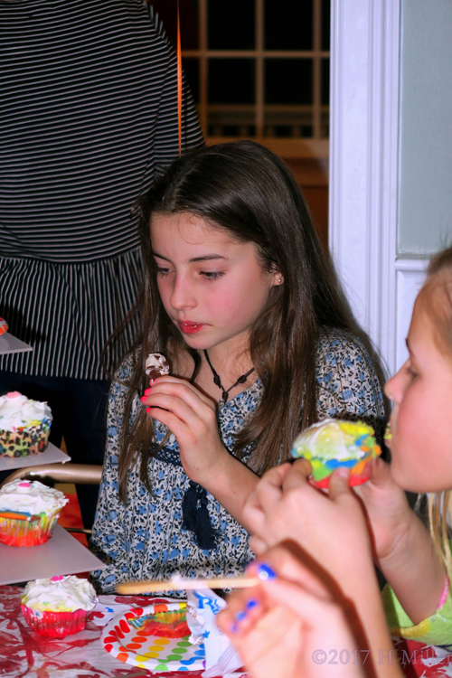 She Is Eating A Cupcake