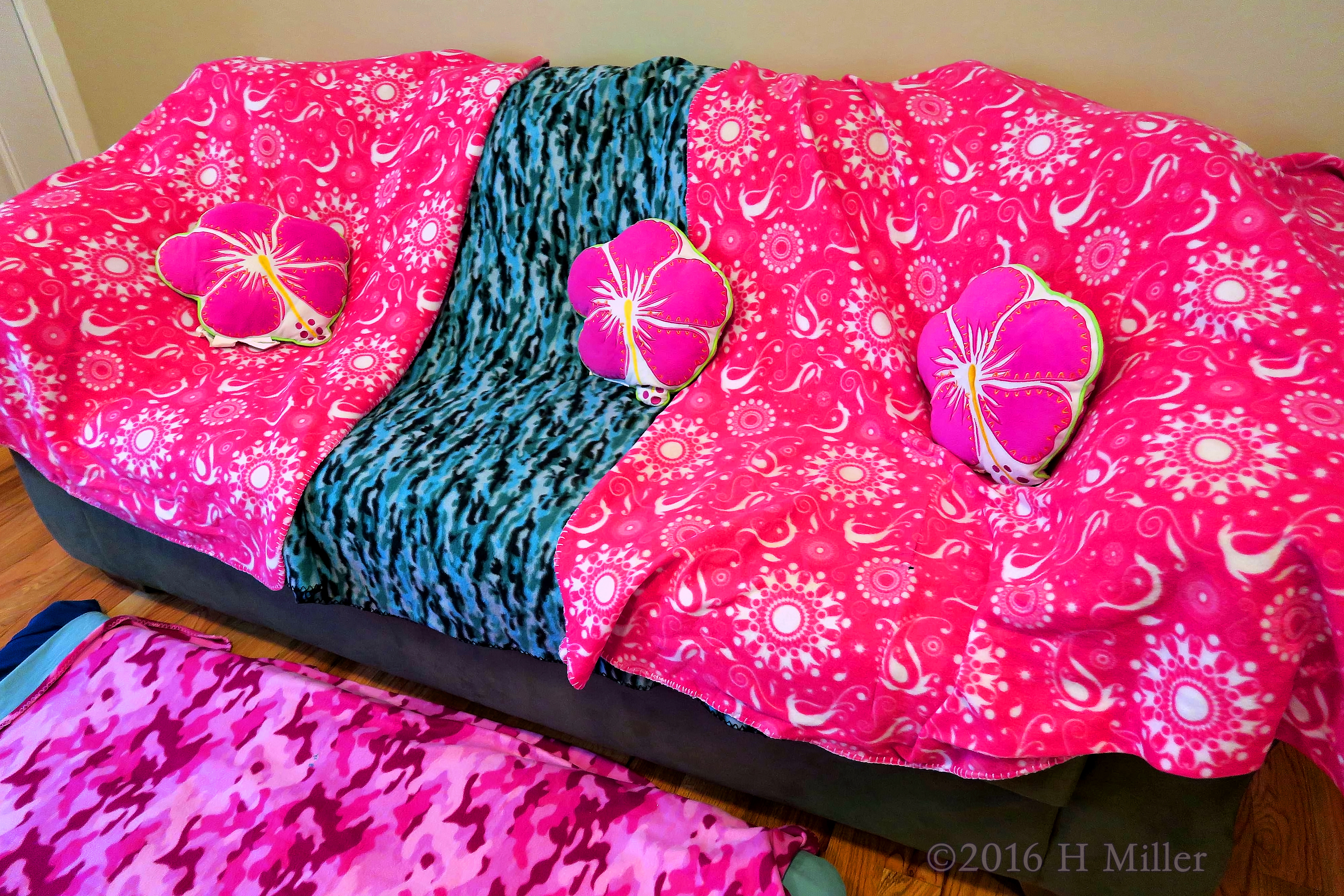 The Kids Spa Couch Decorated With Throws And Pillows. The Kids Spa Couch Decorated With Throws And Pillows.