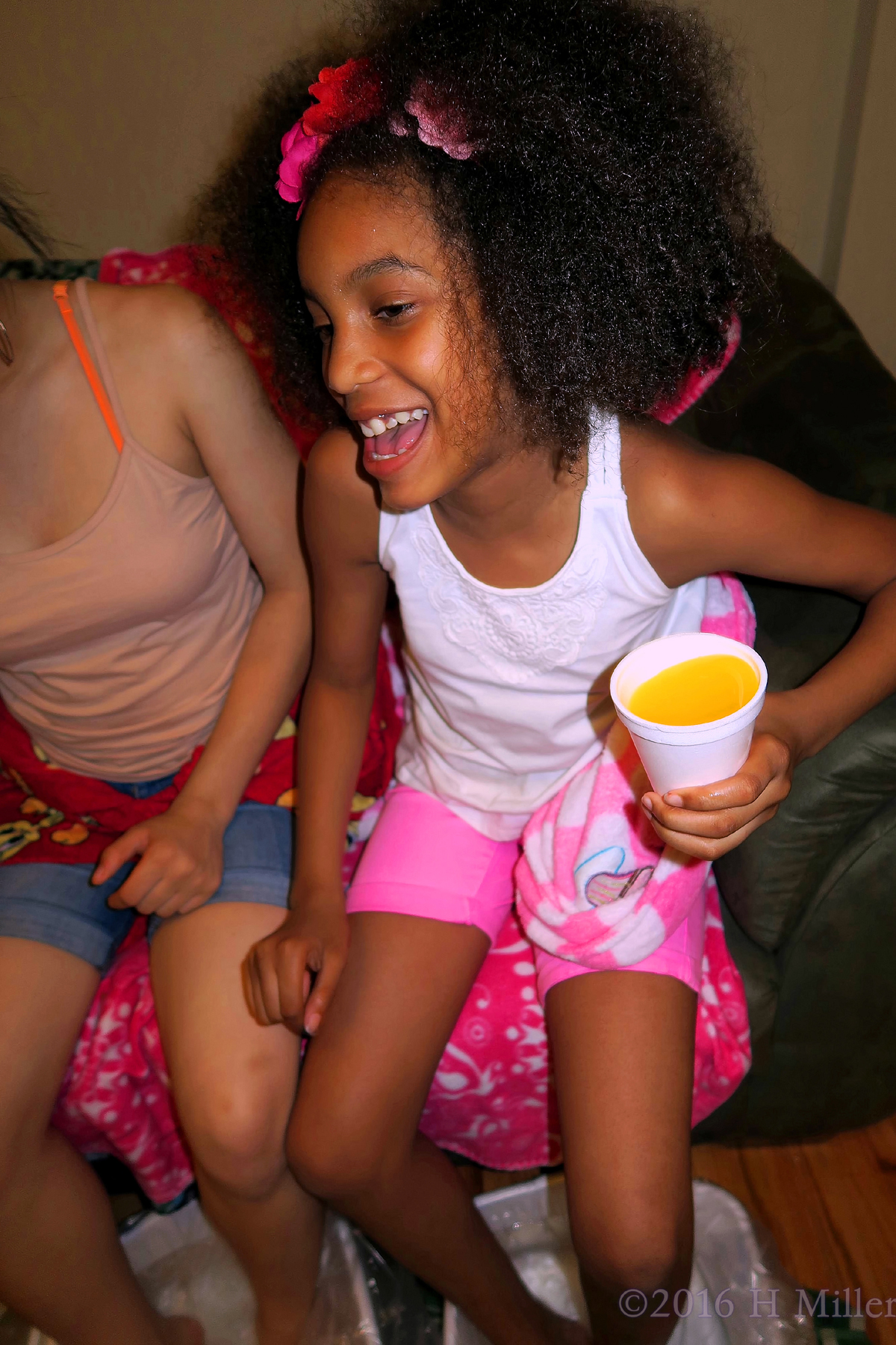 Laughing And Smiling During Her Kids Pedicure. 