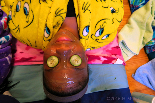 She Is Relaxing With Her Kids Facial Masque On. She Is Relaxing With Her Kids Facial Masque On.