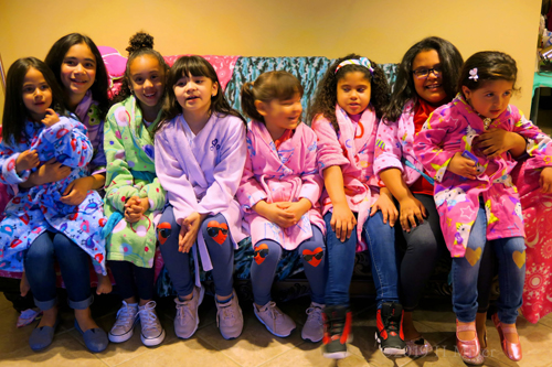 A Group Of Guests In Colorfull Spa Robes Ready For The Spa Party Group Photo A Group Of Guests In Colorfull Spa Robes Ready For The Spa Party Group Photo