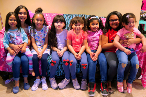 Party Guests Sitting On The Couch Posing For The Camera Party Guests Sitting On The Couch Posing For The Camera